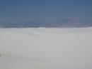 Entrainment of dust and sand by the wind